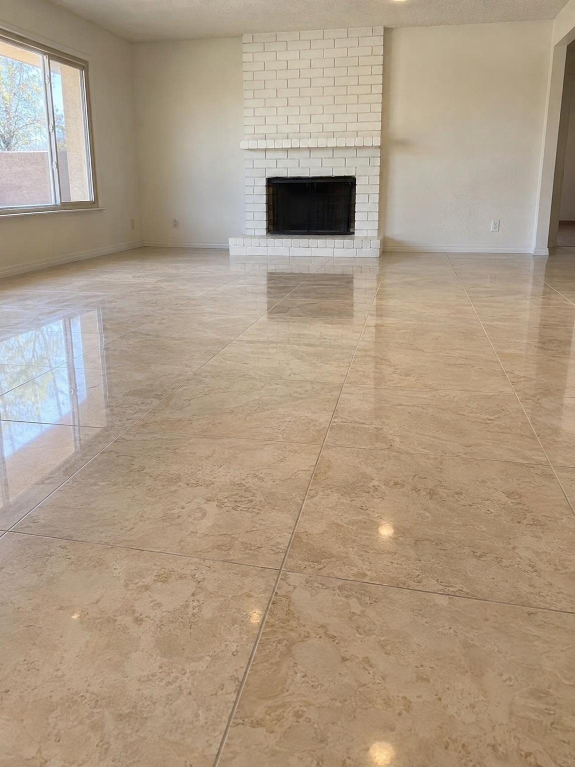 Travertine-look tile floor in front of a white fireplace